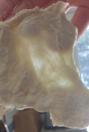 Stretch out a little piece of dough. If the dough becomes see through without breaking then it has been kneaded enough.